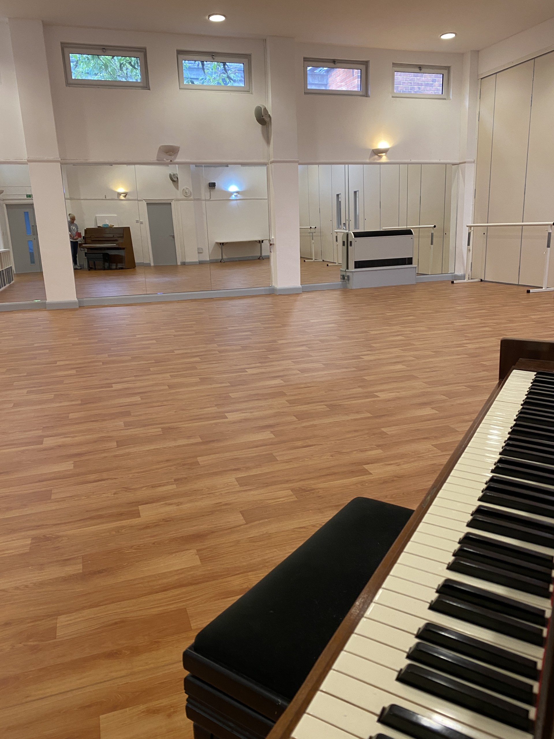 Mirrors and dance equipment inside Studio 208