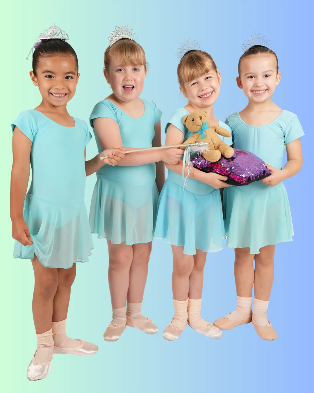 Four Super Stars dancers in aqua with tiaras and a teddy