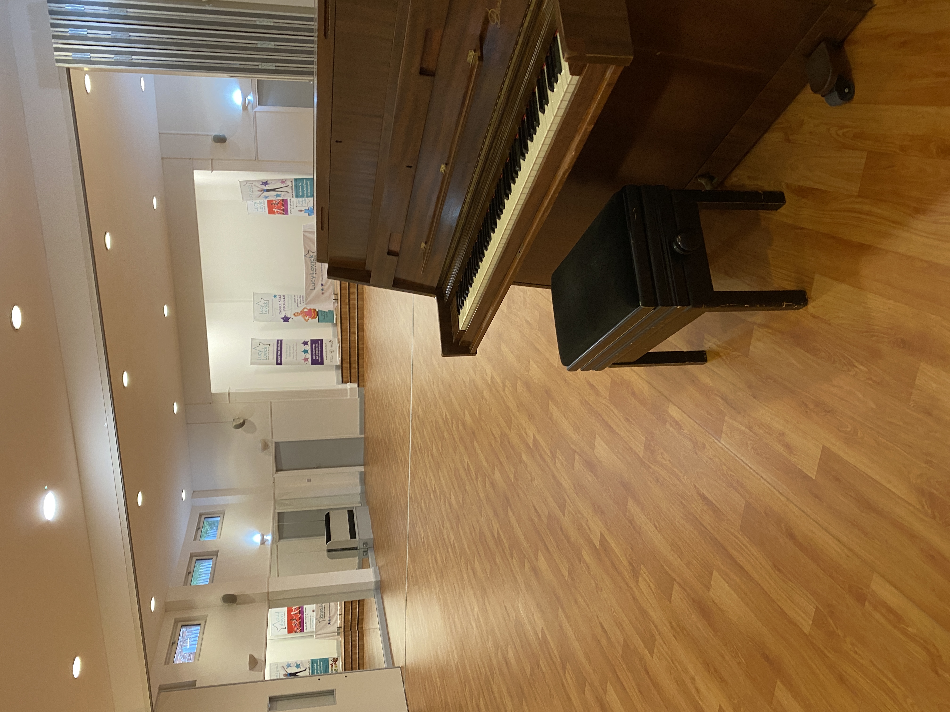 Lucy Lovick Dance Studio with mirrored dance floor and piano